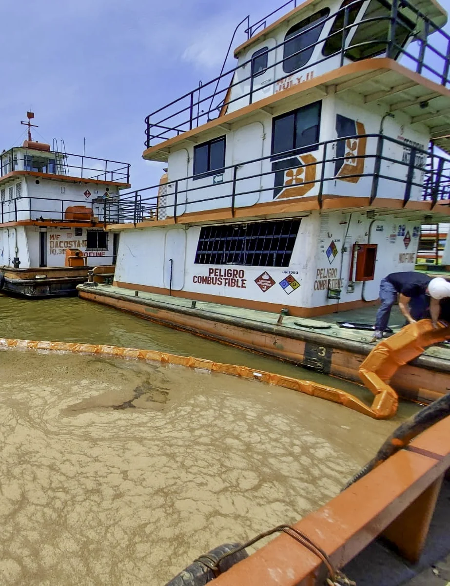 Harbo Boom collecting debris on water
